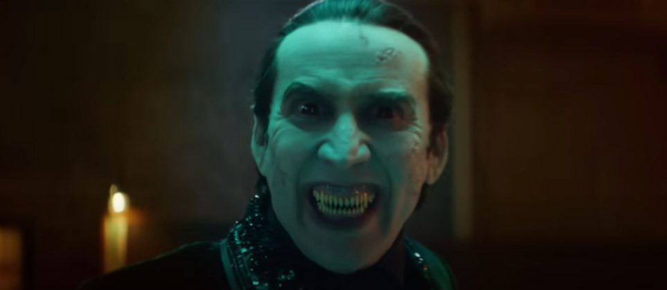 Nicolas Cage as Dracula showing his fangs at the camera