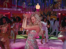 Real-life Blondie Barbie dancing on a dancfloor surrounded by friends