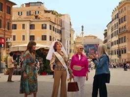 Four older women standing in an Italian street