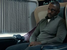 Man sitting in a first class seat on plane