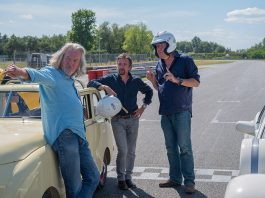 Three old men playing with cars